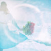 milimo A woman walking with a bouquet on the beach